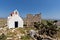 The ruins of a medieval fortress and White church, Mykonos island, Greece