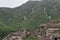 Ruins of an old building near green mountains in Bhangarh village, Rajgarh Alwar, Rajasthan, India