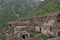 Ruins of an old building near green mountains in Bhangarh village, Rajgarh Alwar, Rajasthan, India