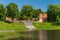 Ruins of old Grobina castle and pond in summer day, Latvia