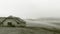 Ruins of old house in Zlatibor vilage with foggy field