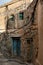 Ruins of old Misfat al Abriyeen in Oman with blue wooden door