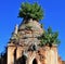 Ruins of an old stone pagoda with green plants growing out at at Inle Lake, Myanmar