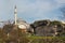 Ruins of old walls of Constantinople and Mihrimah Sultan Mosque in Istanbul, Turkey