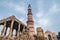 The ruins of the Qutub Minar pillar complex of ancient ruins in New Delhi India