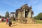 The ruins of the religious temple complex of Angkor Wat, Cambodia. Tourists view landmarks