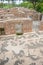 Ruins of roman thermal pool with mosaic