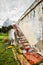 Ruins and stairs of a single story demolished building in a meadow lawn field