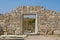 Ruins of stone wall with doorway