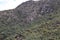 The ruins of a stone watch tower on a mountainside across from Machu Picchu in Peru