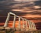 Ruins of the temple of Poseidon at Cape Sounion, sunset colors sk