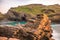 The ruins of Tintagel Castle on Tintagel Island at sunset