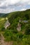 Ruins of Wolfsberg Castle and hill panorama with street near Obertrubach in Franconian Switzerland, Germany