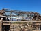 Ruins wooden shelter, Photo of old wooden framework for making tent in top of mountain