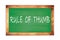RULE  OF  THUMB text written on green school board