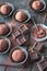 Rum balls with cocoa powder and chocolate slices