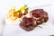 Rump steak. Close up Tender Grilled Beef Meat on White Plate with vegetable decoration.