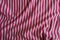 Rumpled striped fabric in pink and white