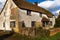 A run down English farmhouse with a thatched roof