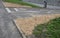 Run-over edges with tracks from heavy trucks. a poorly designed turn radius means damage to curbs, concrete paving. damaged lawn d