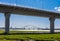 Runcorn, United Kingdom - 05142020: A view of Runcorn`s Jubilee Bridge through the pillars of the New Mersey Gateway Bridge