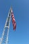 The rungs of a fireman\'s ladder and flag