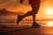 Runner athlete running on beach at sunrise. woman fitness jogging workout wellness concept, Running at the Beach, close up of leg