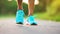 Runner athlete running on forest trail. woman fitness jogging workout wellness concept