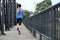 Runner athlete running on iron bridge