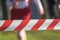 Runner Behind a Barrier in a Race