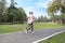 A runner caucasian couple is jogging in the park during summer season healthy or sport concept