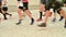 Runner Competitors starting an ultra trail running competition - detail of the legs of runners at the start of a ultra marathon ra