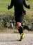 runner during cross-country race with thumbs upwards