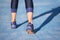 Runner feet running closeup on shoe. woman fitness jog workout welness concept.