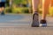 Runner feet running on the road in the outdoor workout park, closeup on shoe. Asian fitness woman running for healthy and relax