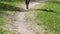 Runner feet running on a rural road