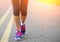 Runner Female Feet Running on Road