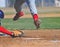Runner leaps over catchers mitt