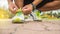 Runner man tying running shoes laces getting ready for race