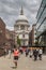 Runner near St Pauls Cathedral passes tourists