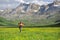 Runner running in a field in a high mountain