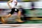 Runner Running a Race on Track with Baton Relay Team Score