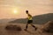 Runner on rural track with sunset or sunrise