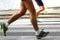 Runner\'s legs during training on asphalt road