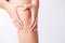 Runner sport knee injury. Closeup young woman in knee pain while running. Healthcare and medical concept