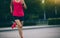 Runner sportswoman jogging and running in urban training workout