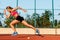 Runner sprinting towards success on run path running athletic track. Goal achievement concept.