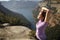 Runner stretching arms after sport in the mountain