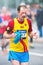 Runner take refreshing water shower in ASICS Stockholm Marathon