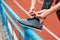 Runner tying black shoelace, , preparing to run